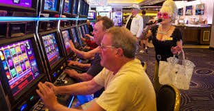 Mobile phone displaying nettikasinot game lobby with slot and live casino tiles